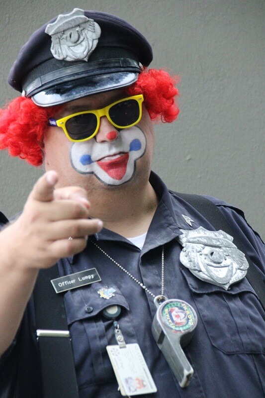 Large clown dressed as a police officer