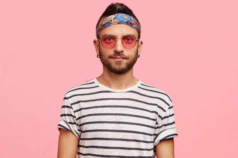 quirky guy with headband and sunglasses